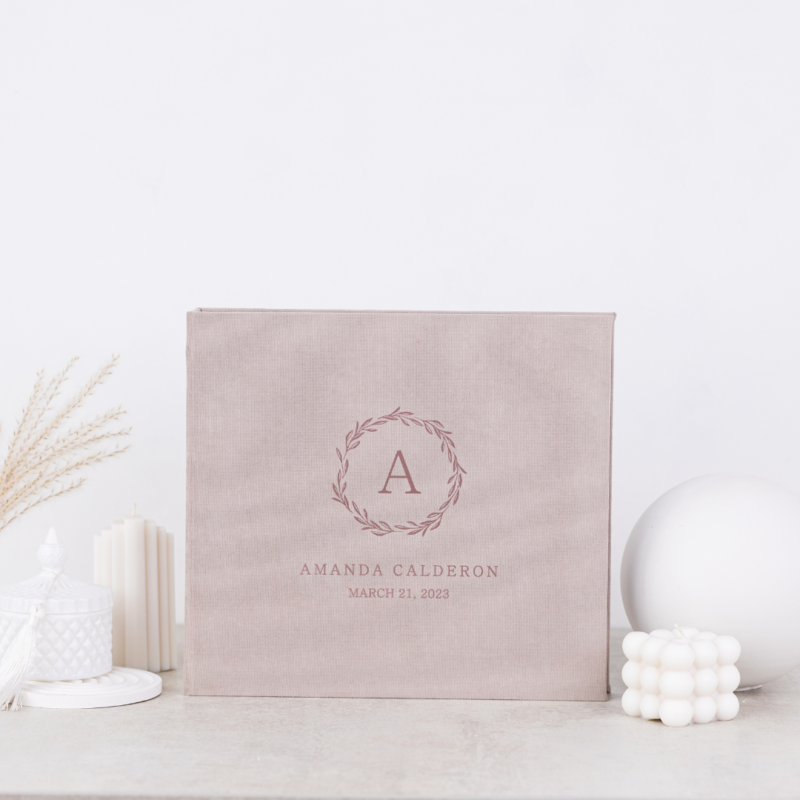 Minimalist baby memory book with fabric cover and customizable details.