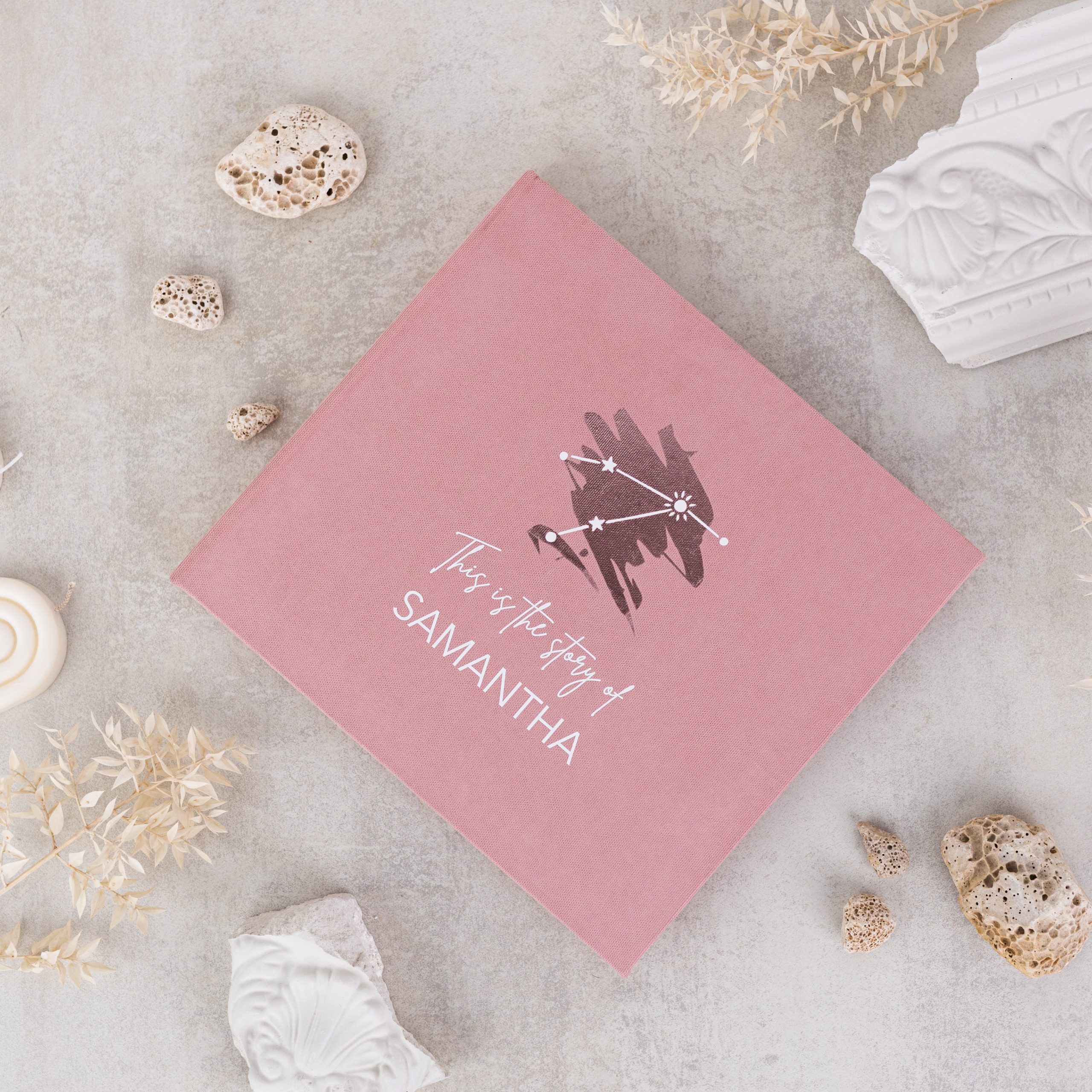 ARIES Minimalist baby memory book with fabric cover and customizable details.