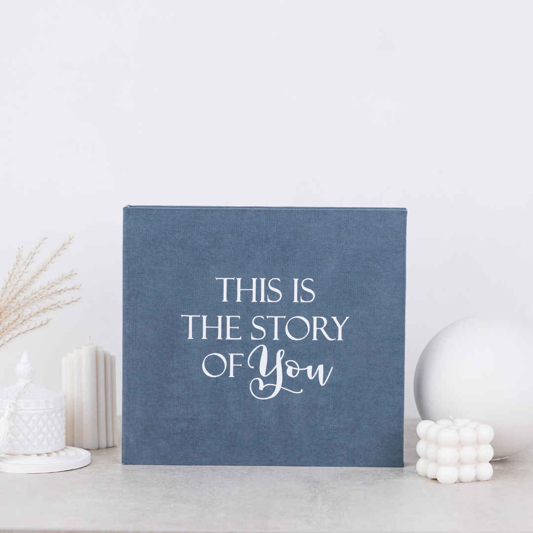 STORY OF YOU Minimalist baby memory book with fabric cover and customizable details.